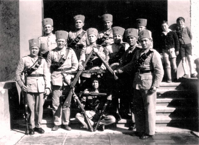 Ghaffirs watching a settlement  in Nesher near Haifa. British authorities provided the guns and uniforms.