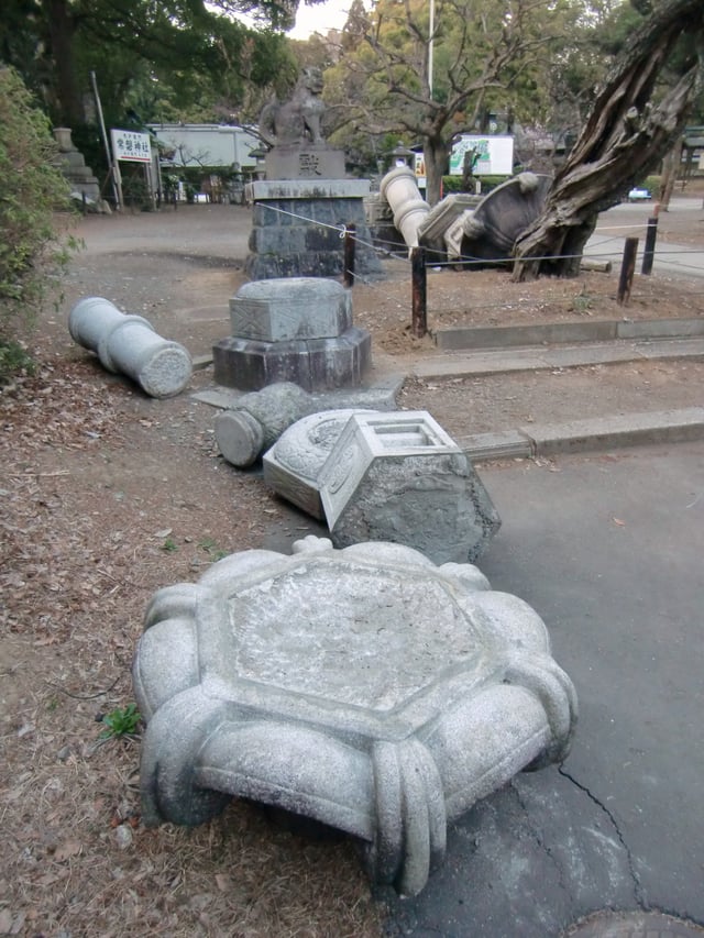 Damage to a traditional lantern at Tokiwa shrine in Mito City