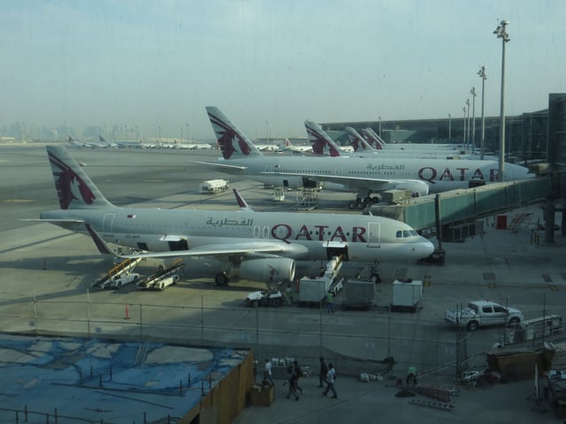 Qatar Airways aircraft on the apron of Hamad International Airport.