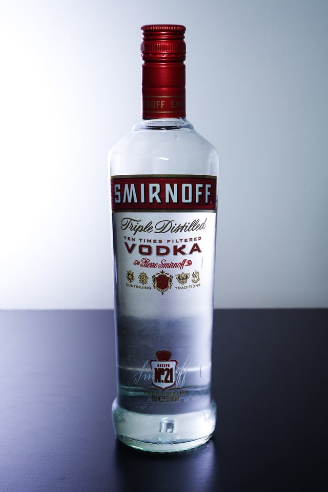 A bottle of Smirnoff Red Label vodka.