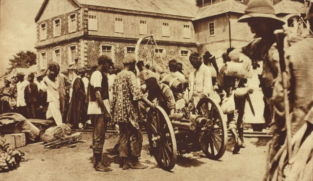 British West African Campaign troops in Freetown, 1914–1916. Published caption: "British expeditionary force preparing to embark at Freetown to attack the German Cameroons, the main object of the attack being the port of Duala. Auxiliary native troops were freely used in African warfare."
