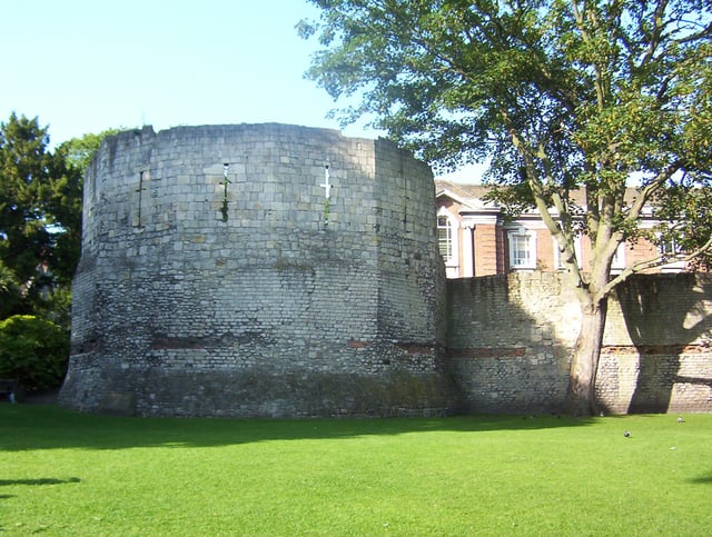 Roman wall and the west corner tower of Eboracum. The top half is medieval.