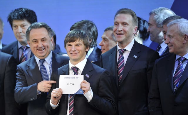 Russian delegates celebrate being chosen as the host of the 2018 FIFA World Cup