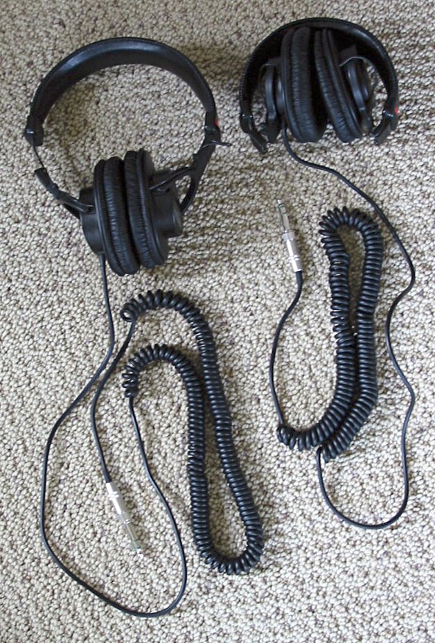 Two Sony MDR-V6 headphones, one folded for travel