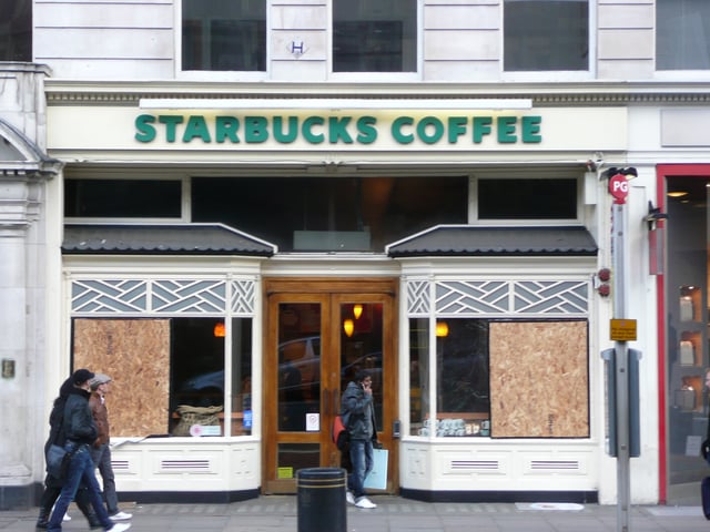 A store on Piccadilly with its windows boarded up after being smashed by protesters after a Stop the War Coalition rally in 2009