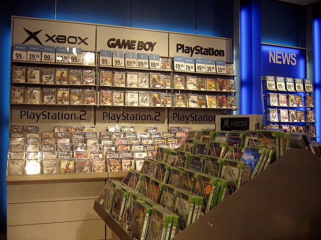 A retail display with a large selection of games for platforms popular in the early 2000s
