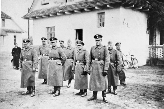 Belzec extermination camp SS staff, 1942. Right to left: Heinrich Barbl, Artur Dachsel, Lorenz Hackenholt, Ernst Zierke, Karl Gringers. Left (uniformed): Friedrich Tauscher, Karl Alfred Schluch (second).