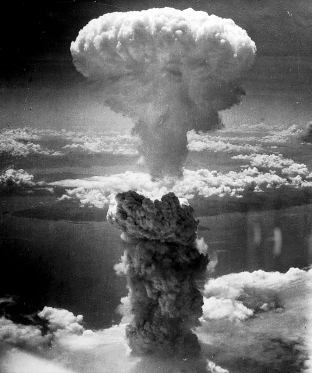 The mushroom cloud from the nuclear explosion over Nagasaki rising 60,000 feet (18 km) into the air on the morning of 9 August 1945
