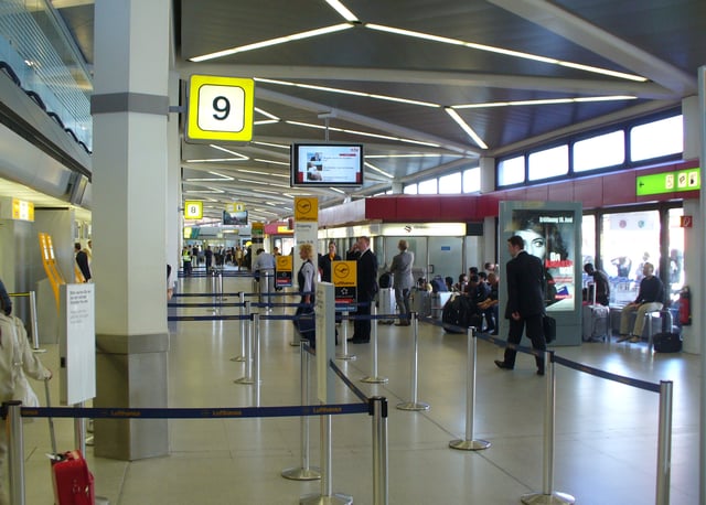 Tegel Airport is famous for its short walking distances, as seen here in Terminal A: buses, taxis and cars can drop off passengers outside the windows on the right, check-in and direct gate access is on the left