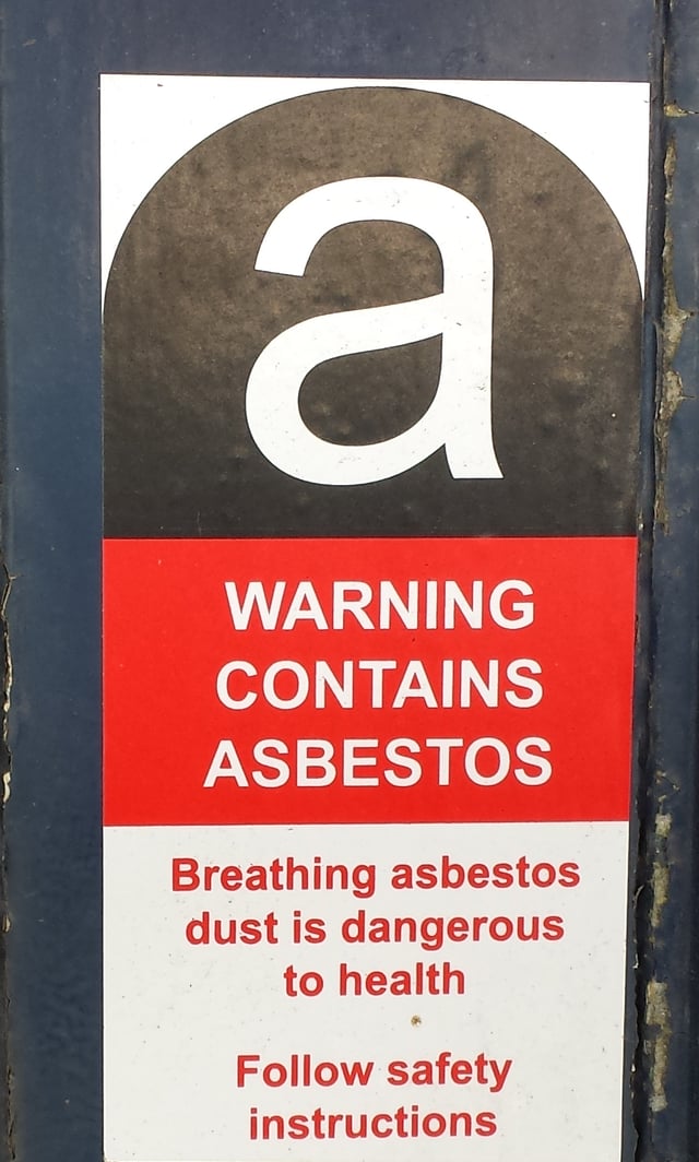 Asbestos warning label.