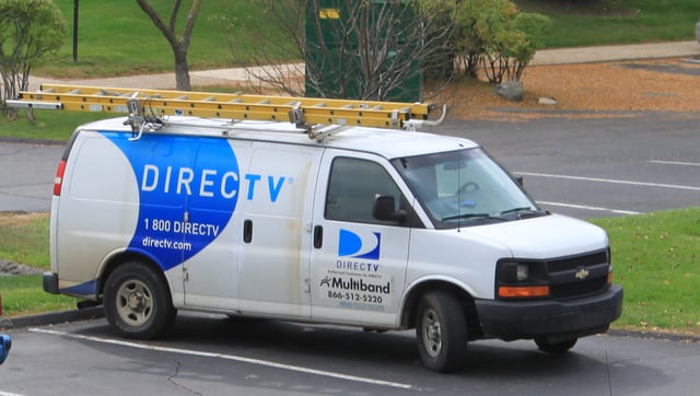 DirecTV service van, Ypsilanti Township, Michigan. DirecTV equipment is installed and maintained by private contractors such as Multiband as shown here. In most areas throughout the United States installation, upgrades, and service are performed by DirecTV home services, a division of DirecTV corporate.