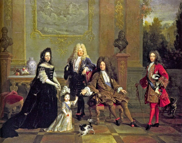 Louis XIV (seated) with his son le Grand Dauphin (to the left), his grandson Louis, Duke of Burgundy (to the right), his great-grandson Louis Duke of Anjou, and Madame de Ventadour, Anjou's governess, who commissioned this painting; busts of Henry IV and Louis XIII are in the background.