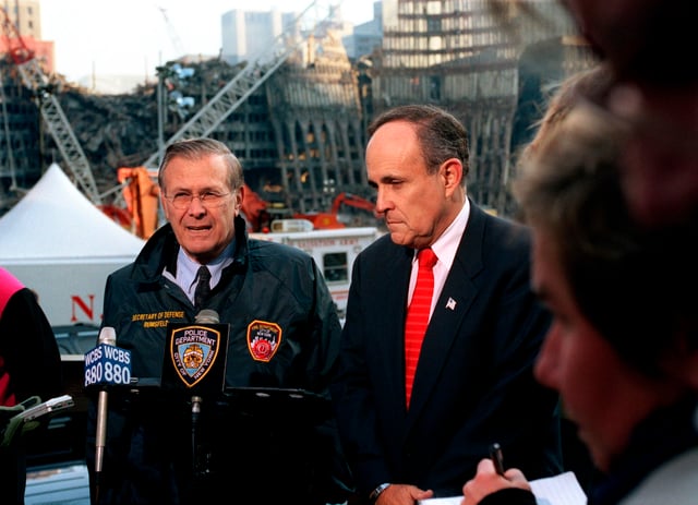 Rumsfeld and New York Mayor Rudy Giuliani speak at the site of the World Trade Center attacks in Lower Manhattan on November 14, 2001