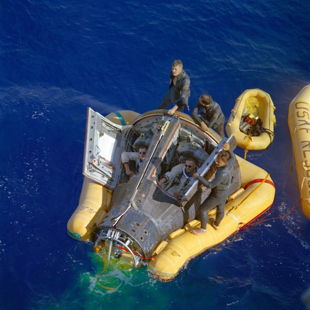 Recovery of Gemini 8 from the western Pacific Ocean; Armstrong sitting to the right.