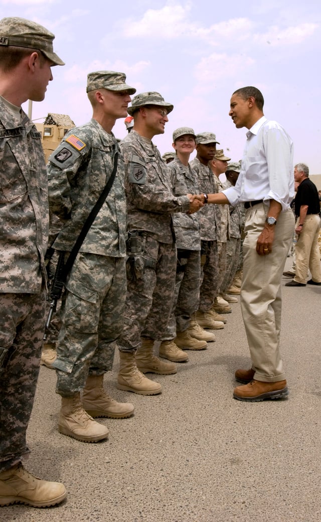 President Barack Obama shaking hands with an American soldier in Basra, Iraq in 2008.