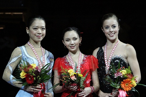 Tuktamysheva with her fellow medalists at the 2011 Skate Canada