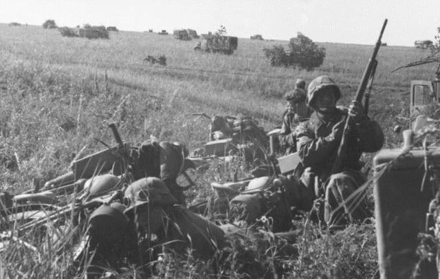 German motorised troops prepare to move out.
