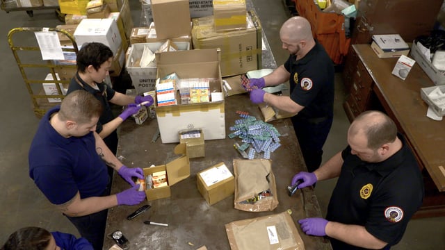The Food and Drug Administration inspects packages for illegal drug shipments