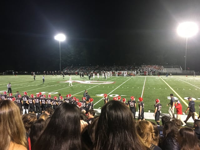 A high school football game during the first quarter