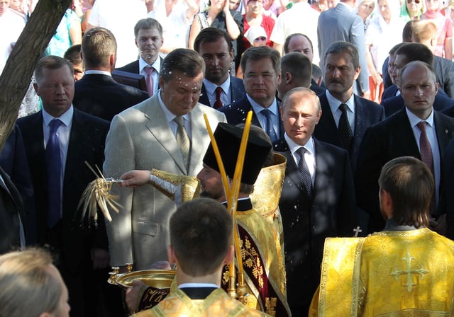 Yanukovych and Putin during moleben celebrated by metropolitan Lazarus of Crimea in memory of 1025th anniversary of Christianization of Kievan Rus'.