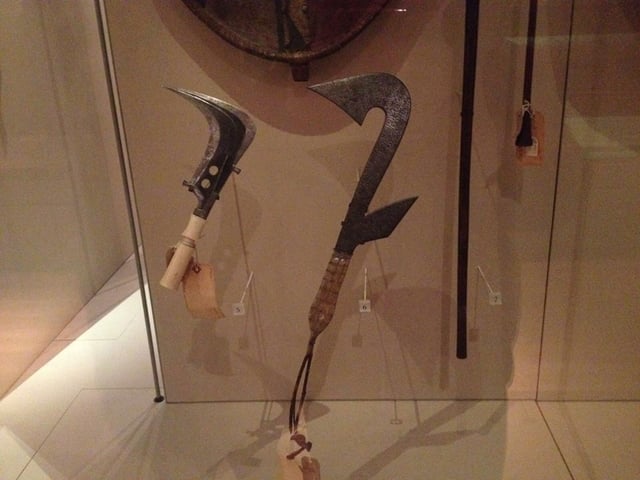 Congolese sickle, or Trumbash, (left) and replica throwing knife (right) at Manchester Museum