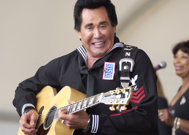 Wayne Newton strums the guitar during his USO show at the Patriotic Festival held on the Virginia Beach Oceanfront. May, 2005.
