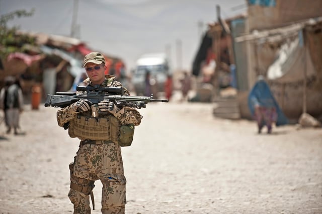 German sniper with a modernized G3SG with a STANAG claw mounted Schmidt & Bender 3-12x50 PM II telescopic sight in Afghanistan in 2011