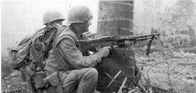 A U.S. Marine fires his M60 machine gun during the fight for the Citadel