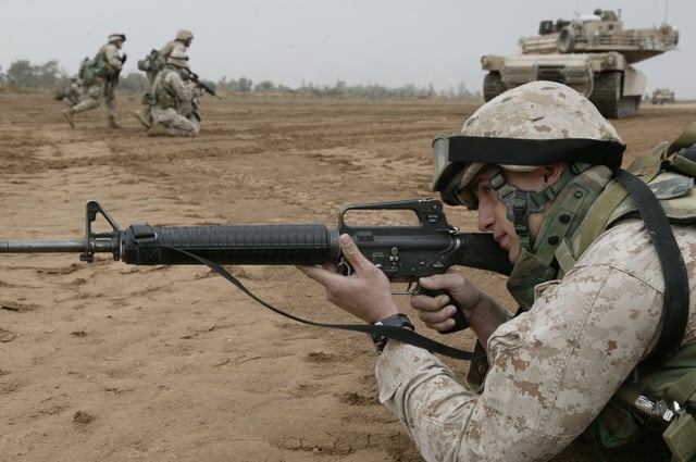 A U.S. Marine with an M16A2 on a training exercise at Camp Baharia, Iraq, 2004