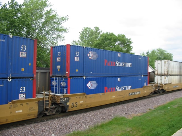 A portion of a "double stack" container train operated by Union Pacific Railroad, the containers are owned by Pacer Stacktrain, the well cars by TTX.