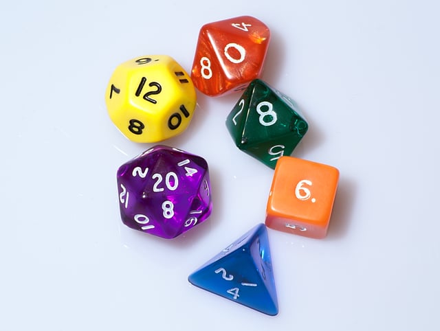 D&D uses polyhedral dice to resolve in-game events. These are abbreviated by a 'd' followed by the number of sides. Shown counter-clockwise from the bottom are: d4, d6, d8, d10, d12 and d20 dice. A pair of d10 can be used together to represent percentile dice, or d100.