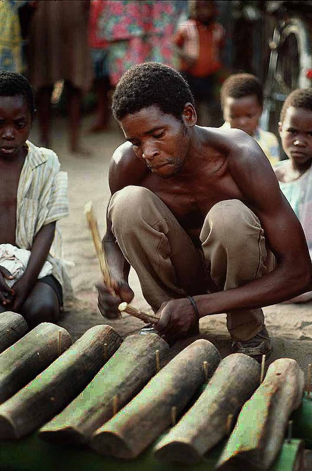 A Malawian man playing a xylophone