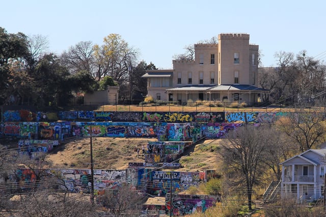 The HOPE Outdoor Gallery, overlooked by the historic Texas Military Academy building, the oldest standing educational building in Texas