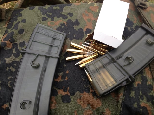 30-round G36 magazines, which insert and release like AK magazines and are not interchangeable with NATO STANAG magazines. Side inter-connect studs are visible.