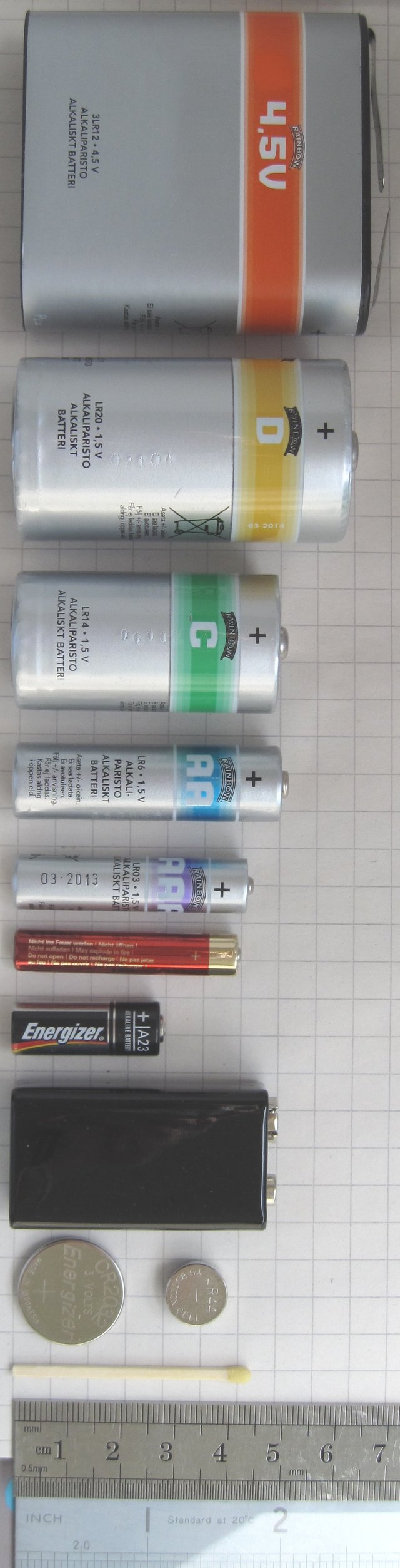 From top to bottom: a large 4.5-volt (3R12) battery, a D Cell, a C cell, an AA cell, an AAA cell, an AAAA cell, an A23 battery, a 9-volt PP3 battery, and a pair of button cells (CR2032 and LR44)