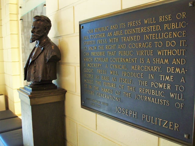 A Joseph Pulitzer bust and plaque in the Columbia Journalism School lobby