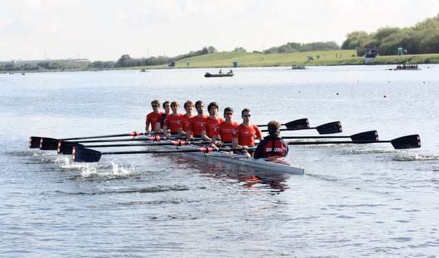 Rowers in a coxed eight (8+), a sweep rowing boat