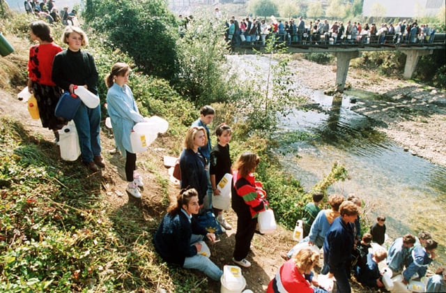 People waiting in line to gather water during the Siege of Sarajevo, 1992