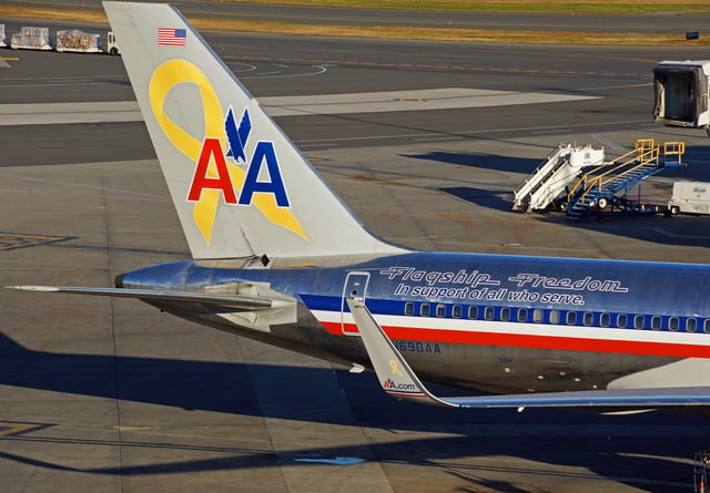 AA "Flagship Freedom" Boeing 757-200, labeled with a "yellow awareness ribbon" symbol, representing support of the United States Armed Forces overseas operations.