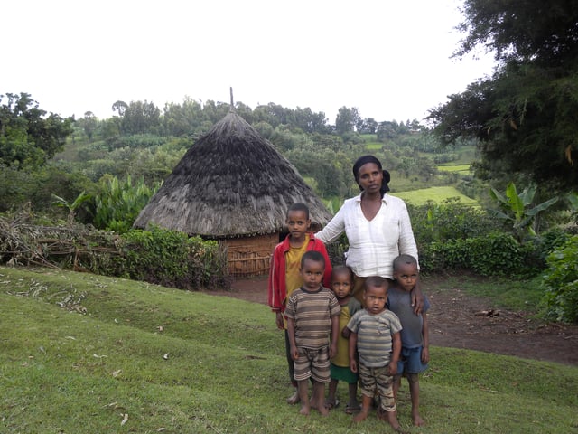 Kambaata family in front of their tukul in the Kembata Tembaro Zone