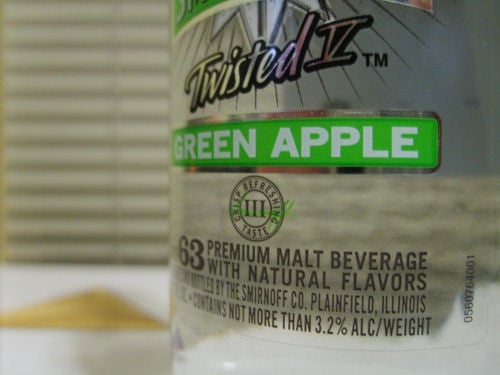 Smirnoff's number and other information is shown at the bottom of the label. Depicted here is No. 63 — Smirnoff Twisted V Green Apple.