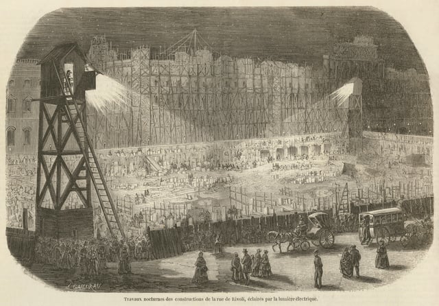 Enormous public works projects reconstructed the center of Paris. Here, work to extend the Rue de Rivoli continues at night by electric light (1854).