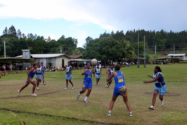 A pass takes place during a women's netball game in Fiji.