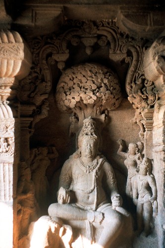 Left: Indra as a guardian deity sitting on elephant in Jain cave temple at Ellora