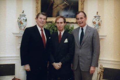 Stone with President Ronald Reagan and then-Vice President George H. W. Bush in 1982