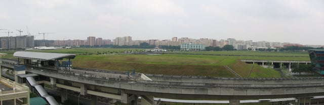 Panoramic view showing the Sengkang LRT Line (SKLRT). Renjong LRT station lies to the left, and the Sengkang Depot for North East Line and SKLRT to the right. In the distant background lie Buangkok and Hougang.