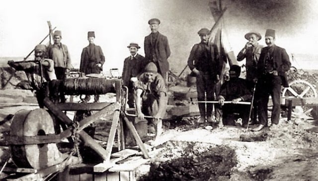 Oil workers digging an oil well by hand at Bibi-Heybat.