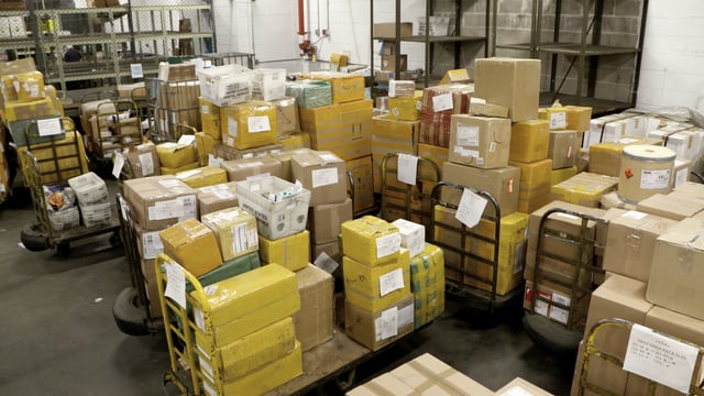 Packages awaiting inspection at the International Mail Facility in JFK airport