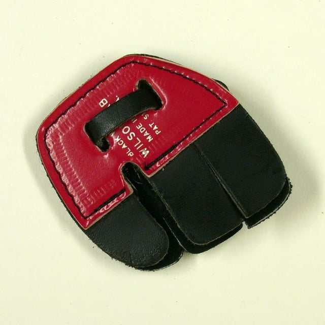 A right-hand finger tab to protect the hand while the string is drawn.