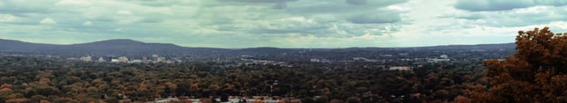 Looking west, a view of Huntsville from atop Chapman Mountain. From south to north (left to right), Downtown Huntsville, Interstate 565, U.S. Space & Rocket Center, the Madison County Jail, University Drive, and Memorial Parkway are all visible.